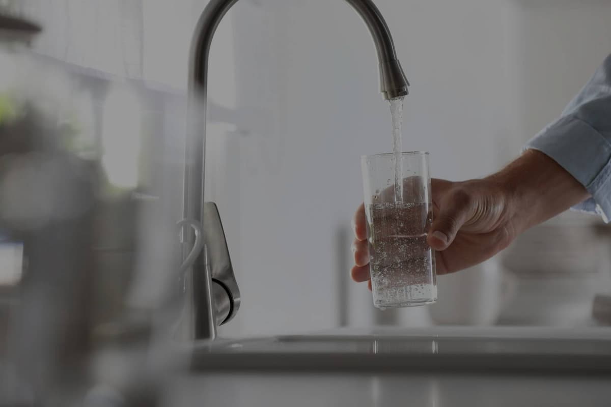 Clean water pouring from kitchen faucet